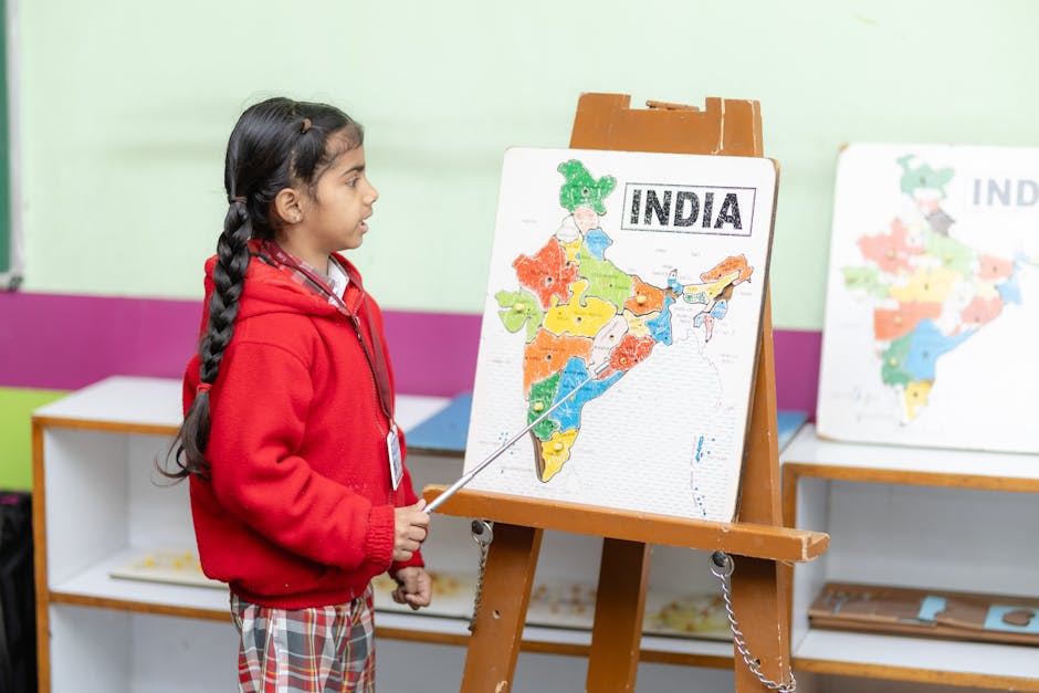 Young student points to India map in a classroom, fostering education